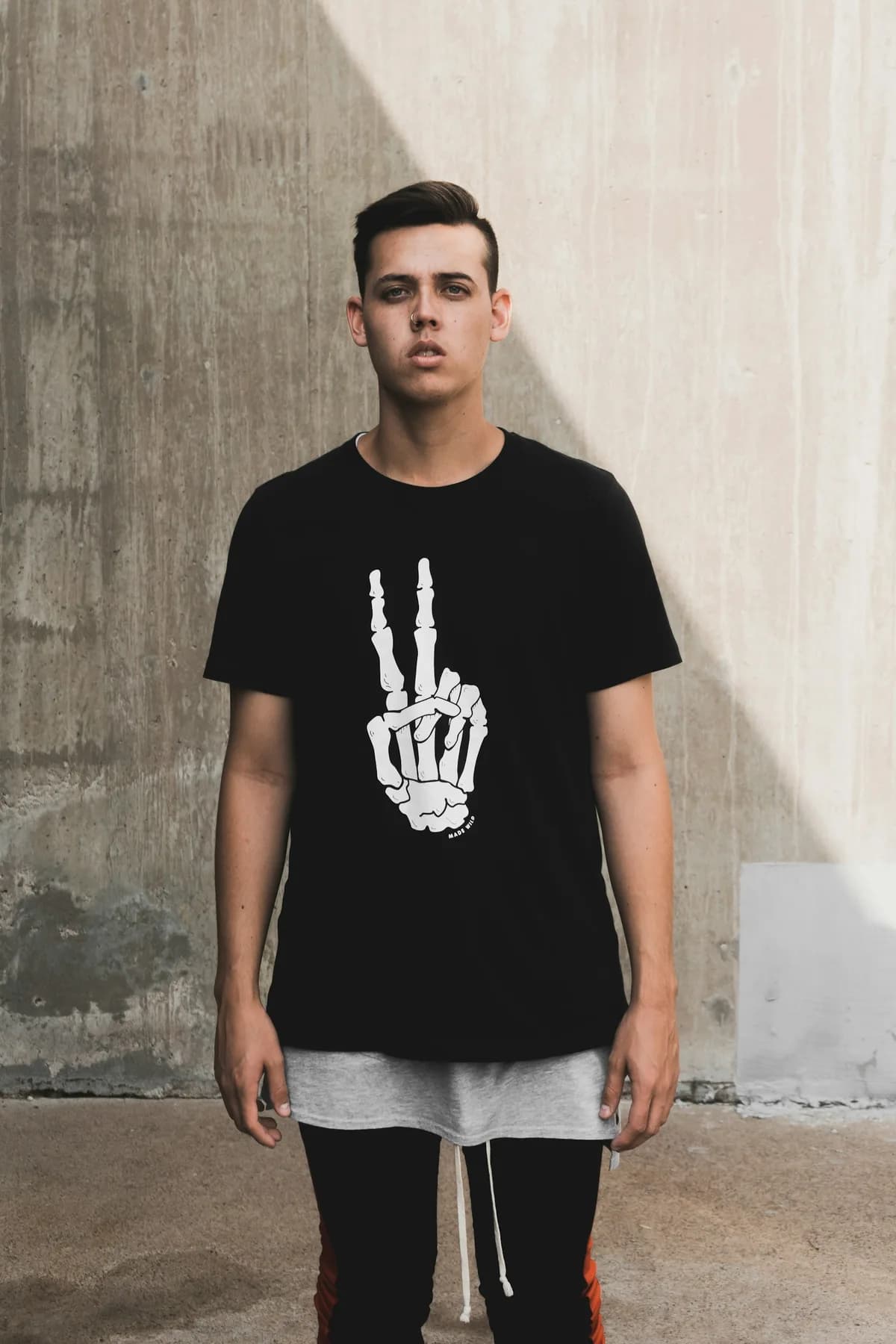 Model wearing a graphic summer tee